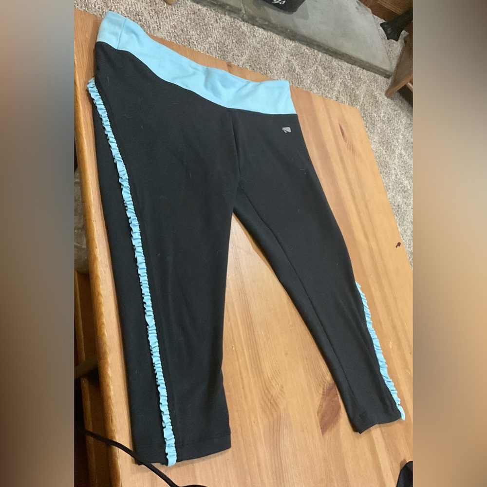 Marika; Black capri Leggings light blue/teal ruffles on sides size 14/16 large.
